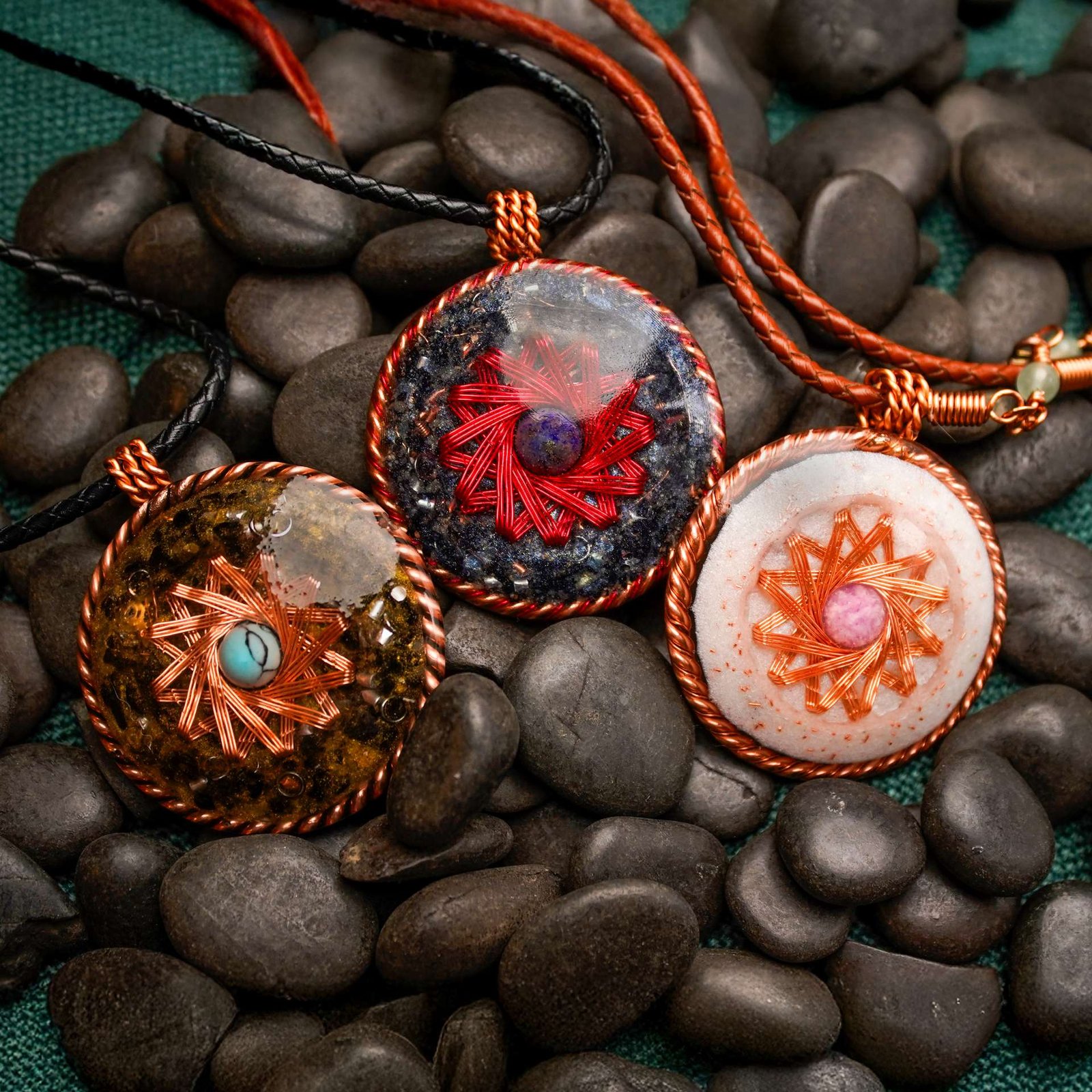 Copper energy jewelry set showing Red Magma, Pink Pearl and Blue Velvet pendants