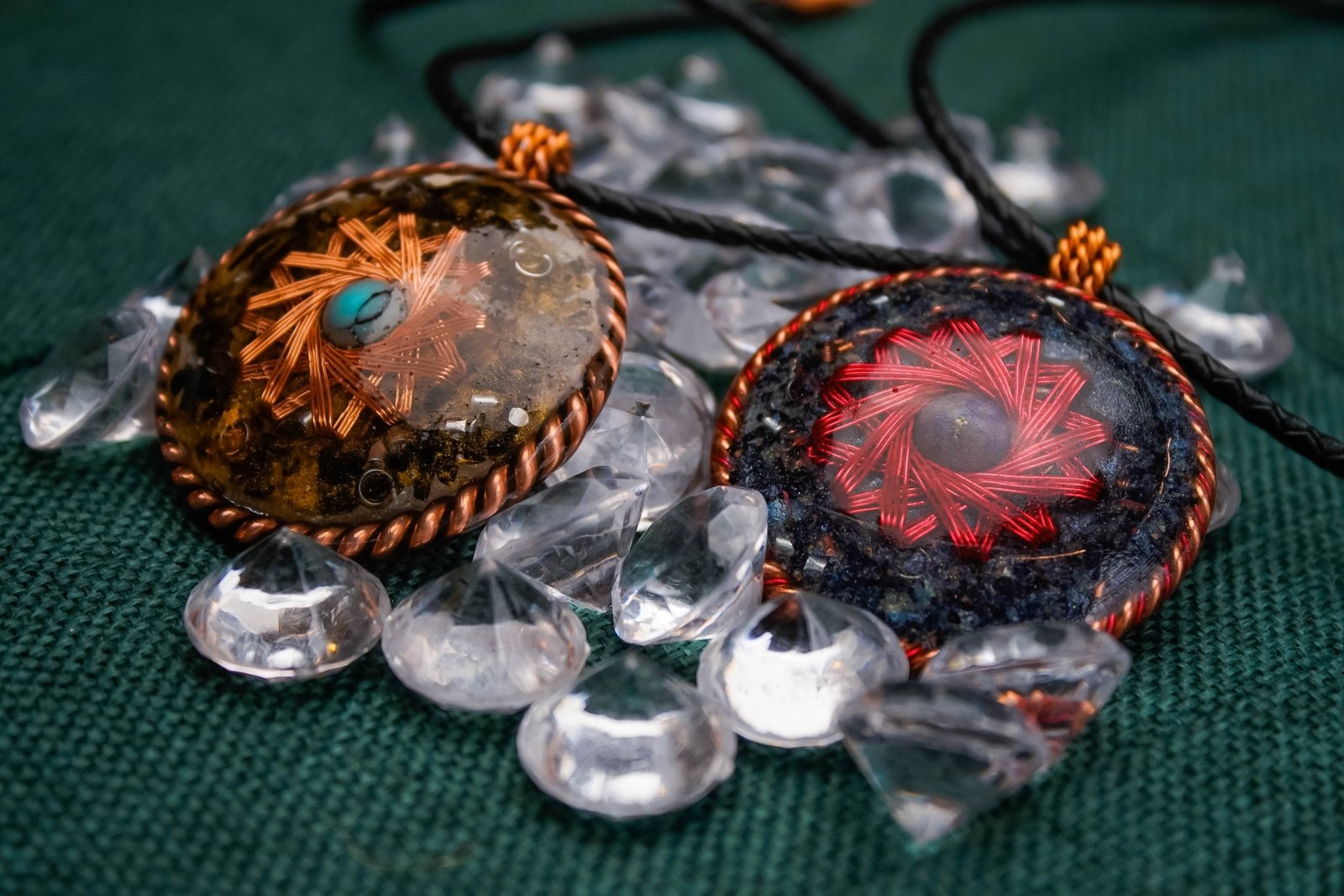 Star coil pendants beauty shot on table with crystals
