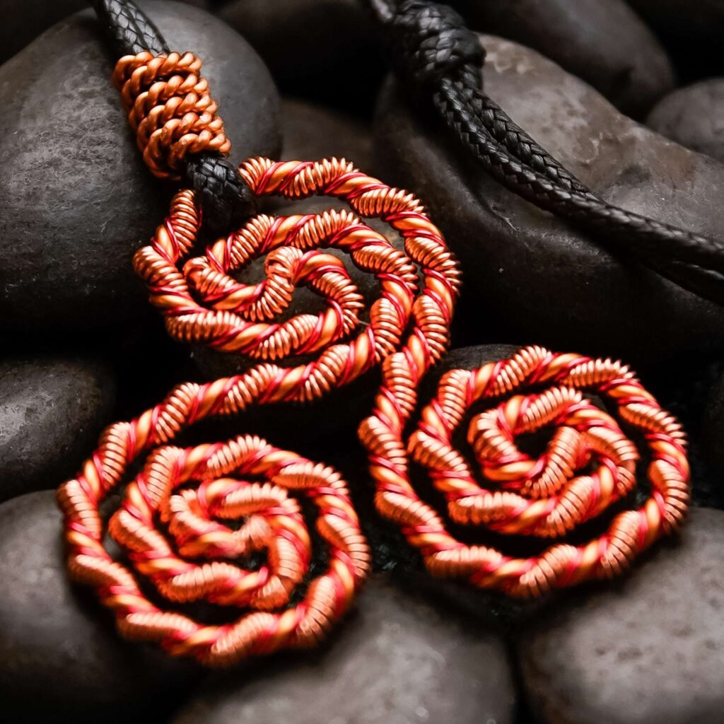 Macro view of triskelion energy necklace illustrating resonant field and handcrafted finish